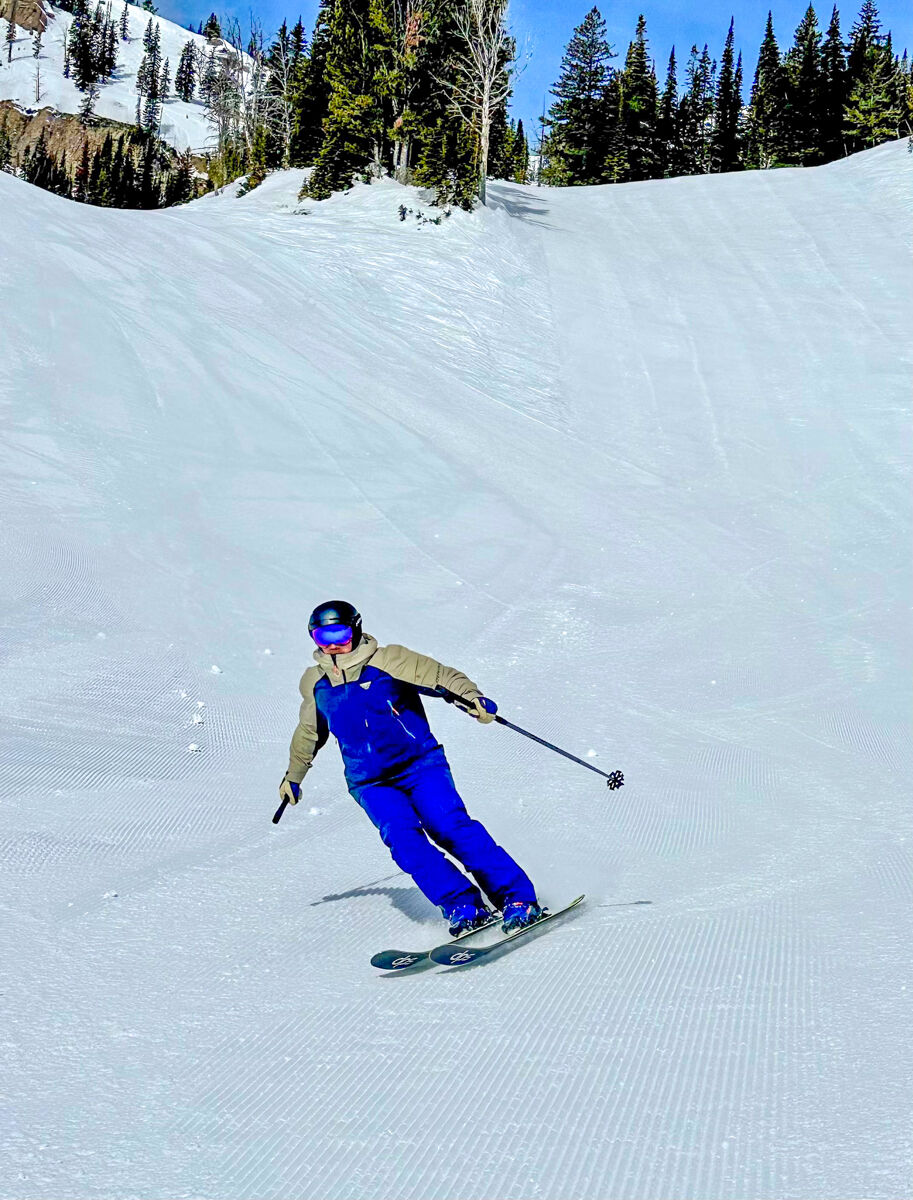 Man Skiing Jackson Hole in Blue Ski Outfit in March on a Sunny Day