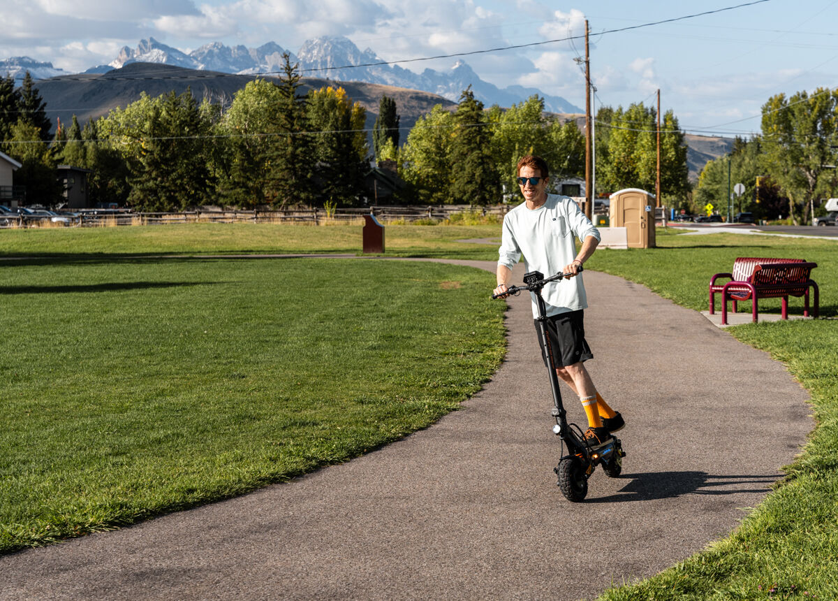 Mike Hardaker Mountain Weekly News Gear Tester Riding E-Scooter in Jackson Hole, WY
