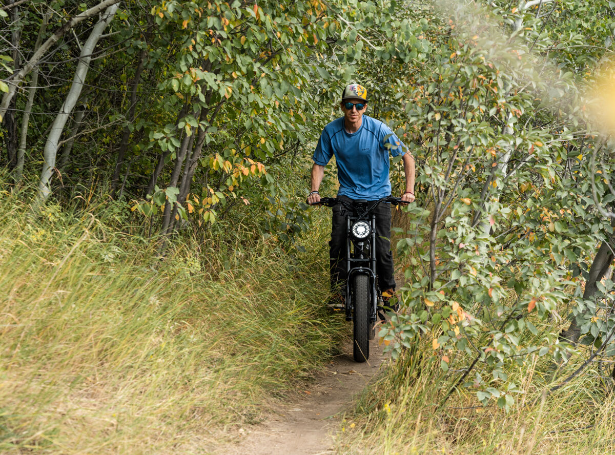 Mike Hardaker Standing Up While Riding E-Bike on Technical Trails