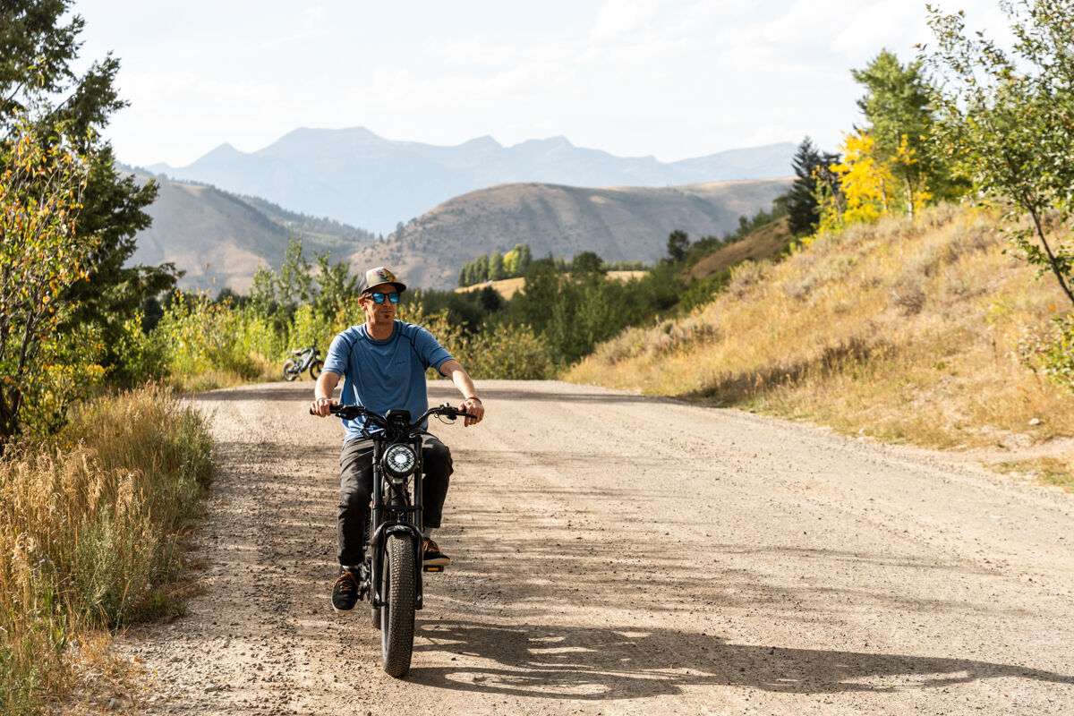 Man Riding E-Bike with Blue Shirt