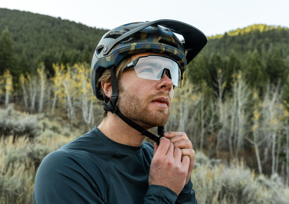 Man Putting on Smith Bike Helmet