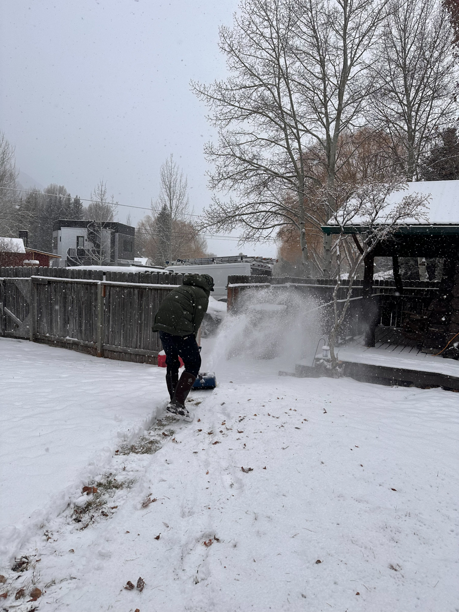 Man Bending Over Snow Shoveling