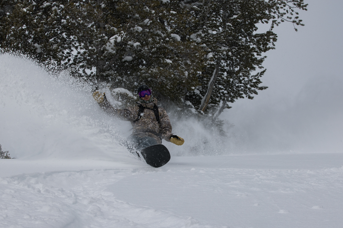 Man Snowboarding on Powder Day