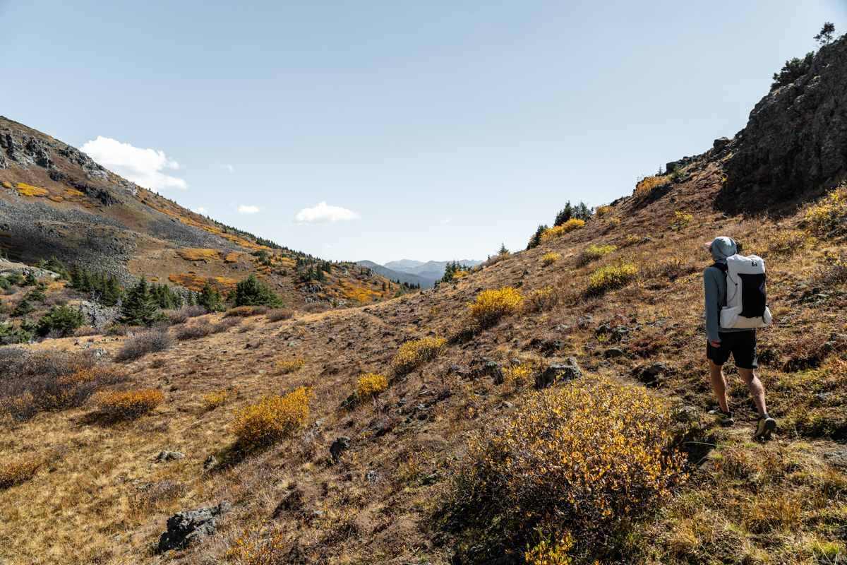 Man Backpacking with Fall Colors and Leaves