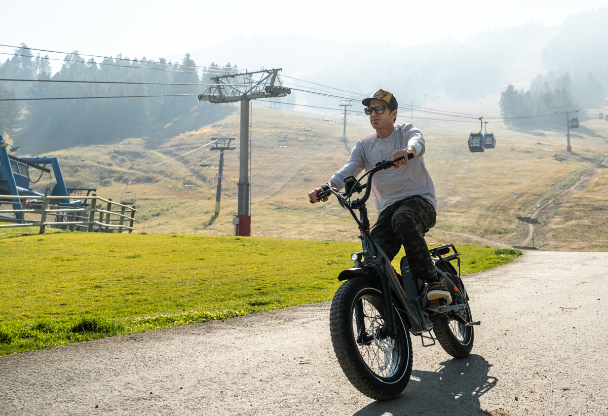 Mike Hardaker rides an electric bike under the chairlift in Jackson WY