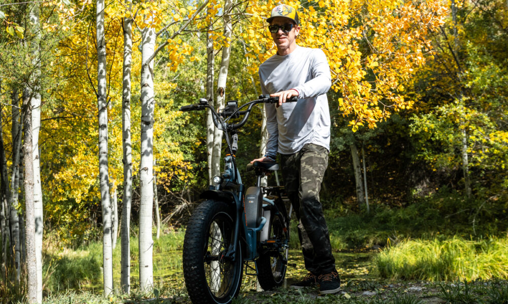 The 10 Best Electric Bikes of 2025: Tested & Reviewed Man Walking with E-Bike