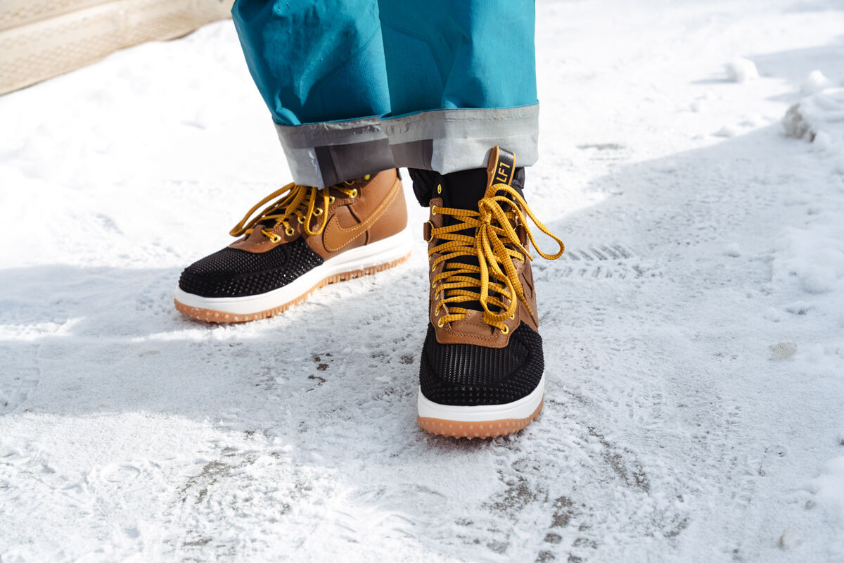 Man Walking on Snow and Ice with Nike Shoes