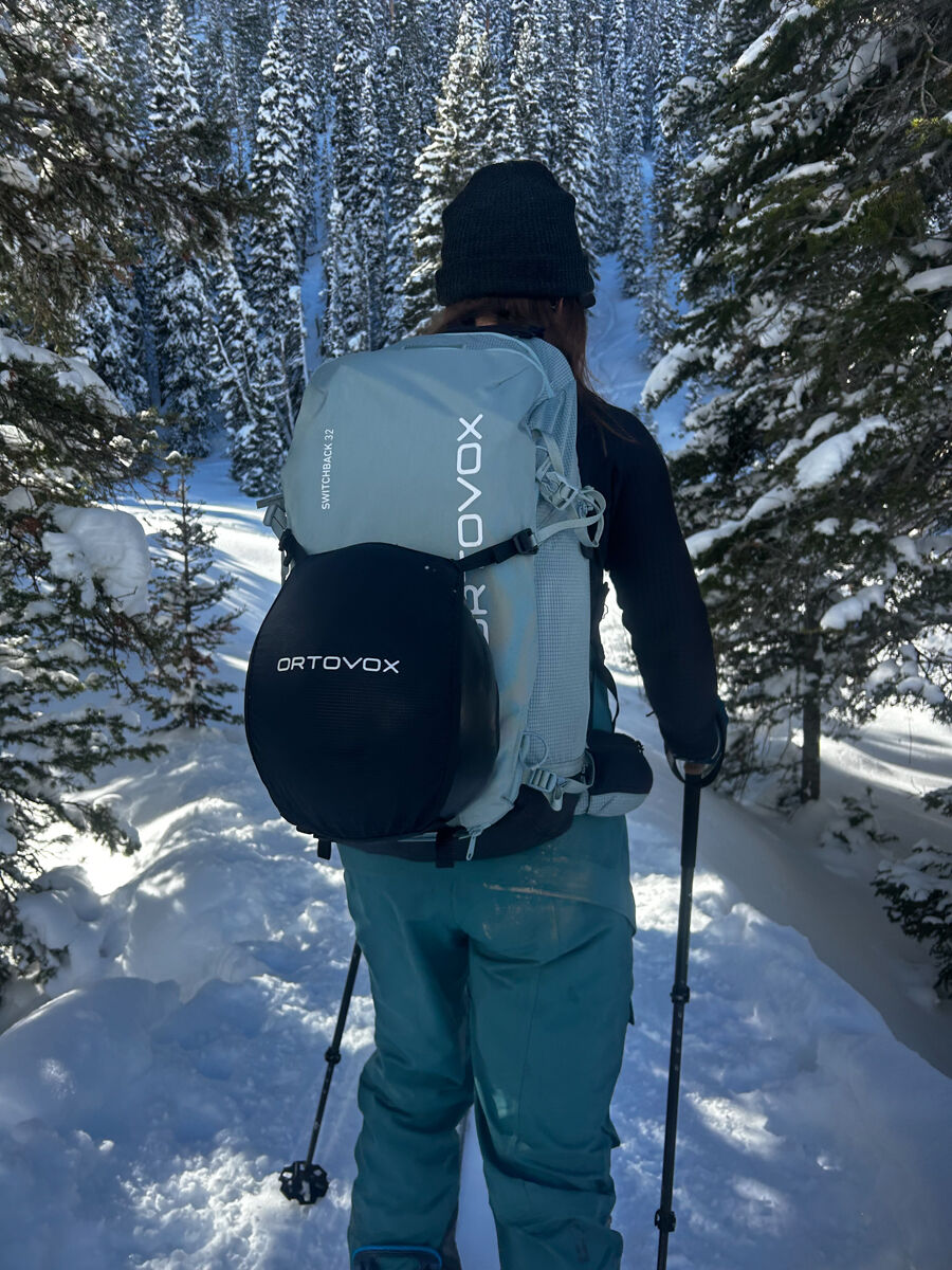 Women Wearing Ski Backpack