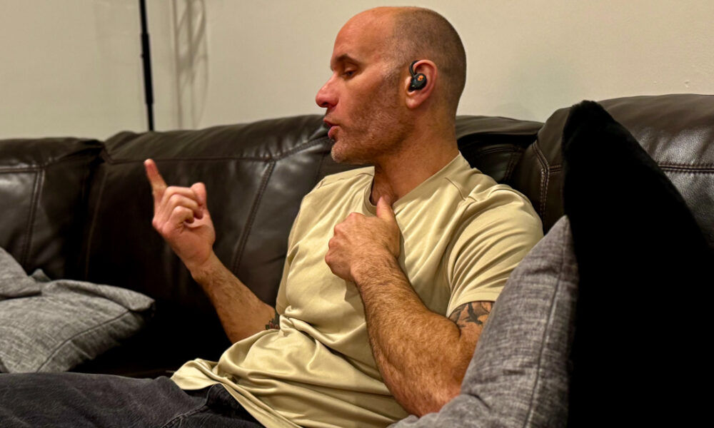 Man Wearing In ear Earbuds