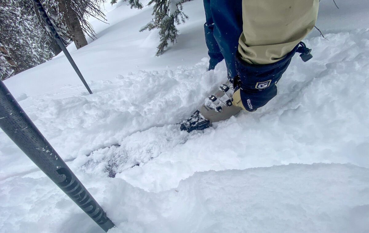 Man Adjusting Ski Boot in the Backcountry