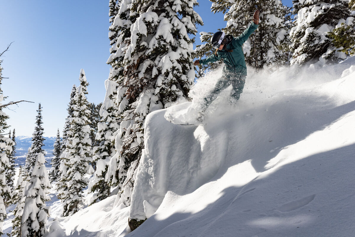 Women Riding Pillow on Snowboard