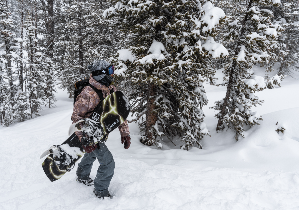 Snowboarder Hiking Jackson Holke Backcountry Out of Bounds
