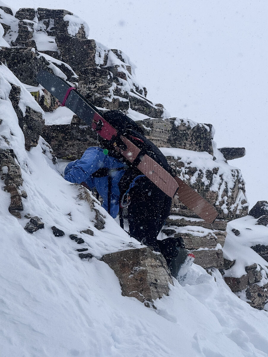 Women Rock Climbing While Skiing