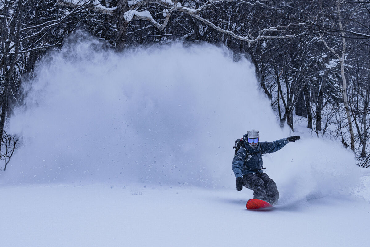 Snowboarder Riding Powder in Japan