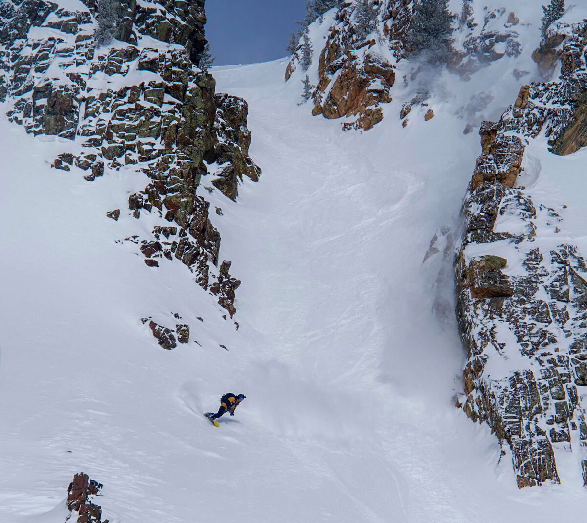 Snowboarder in Big Mountain Terrain
