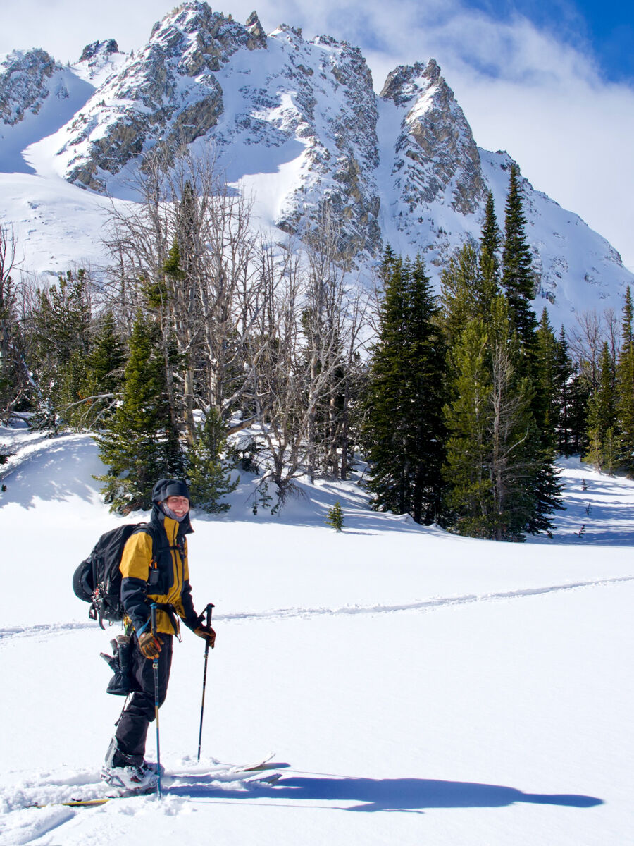 Man Splitboarding Near Big Mountains