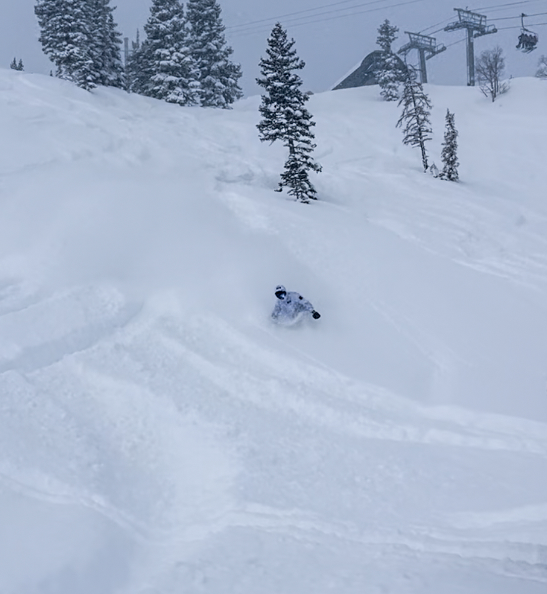 Man SNowboarding Deep Powder