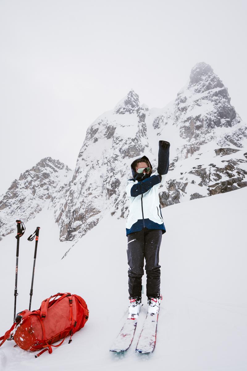 Women Standing Atop Mountain