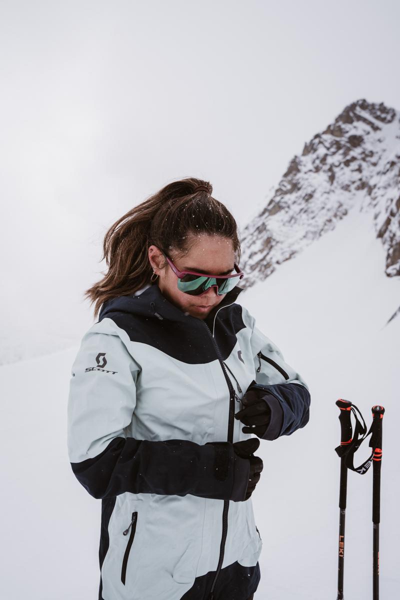 Woman Standing Atop a Mountain