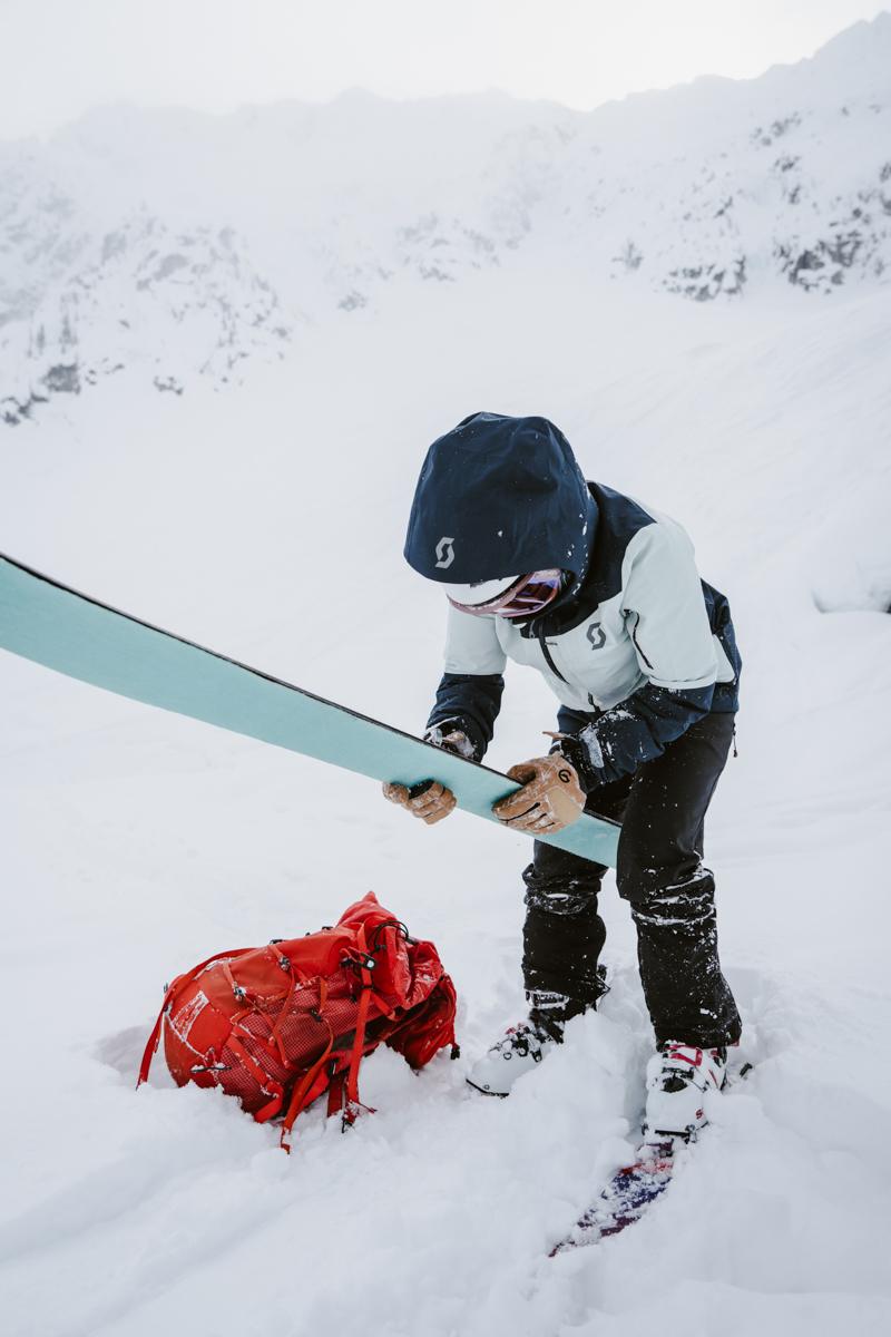 Women Removing Climbing Skins for Skiing