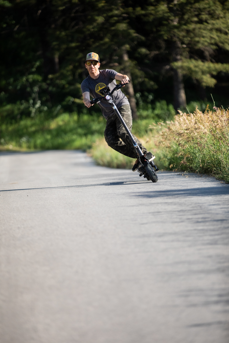 Man Surfing an Electric Scooter