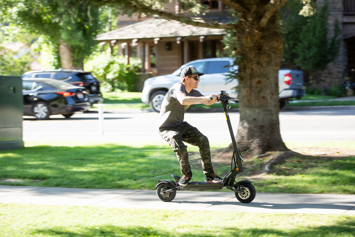 Man Going Fast on Electric Scooter