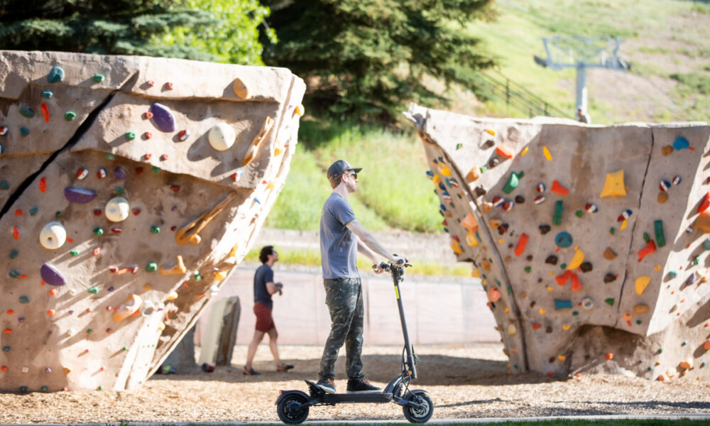 Kaabo Mantis X Plus Review Man Riding Electric Kaboo Mantis X Plus Through Park