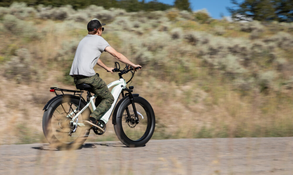 Man Riding E-Bike on Gravel Roads