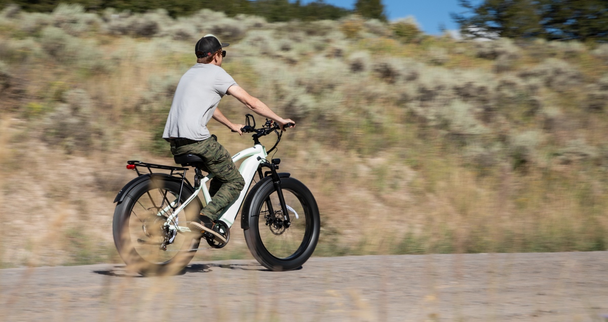 Man Riding E-Bike on Gravel Roads