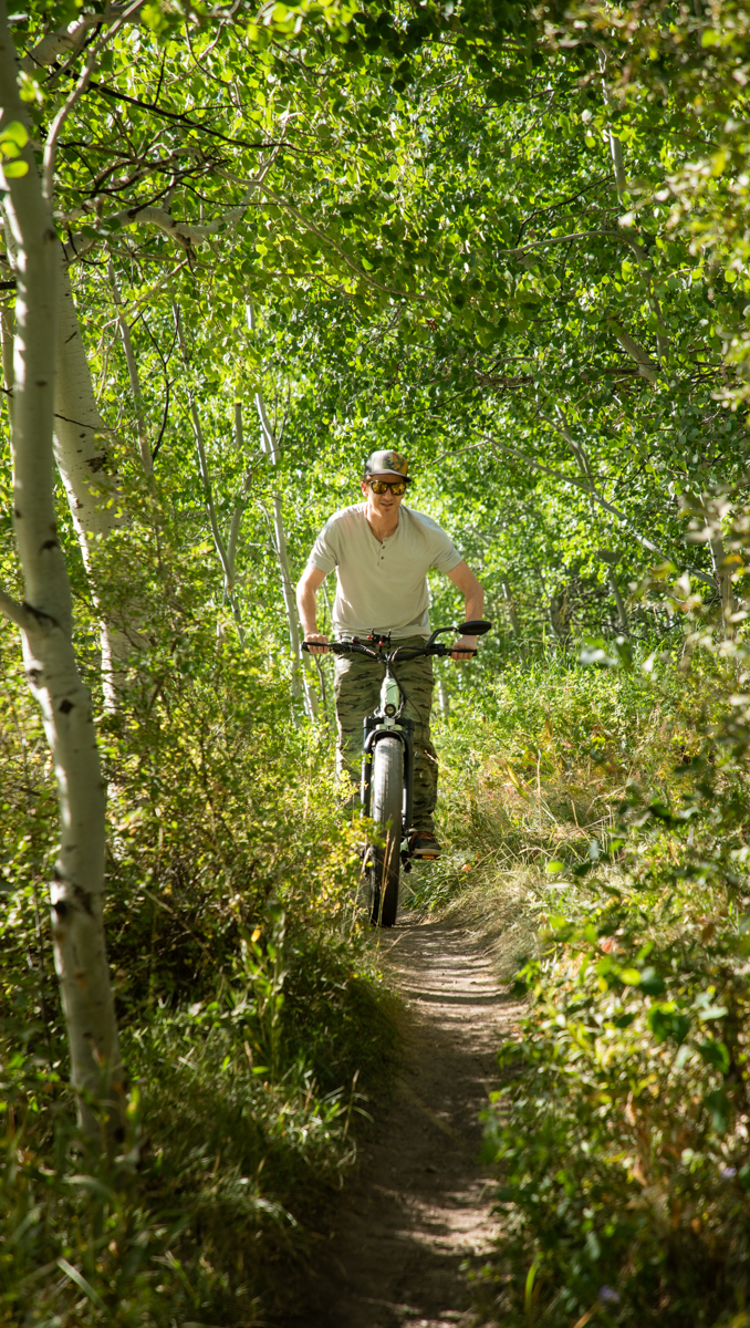 Man Riding E-Bike on Dirt Trails
