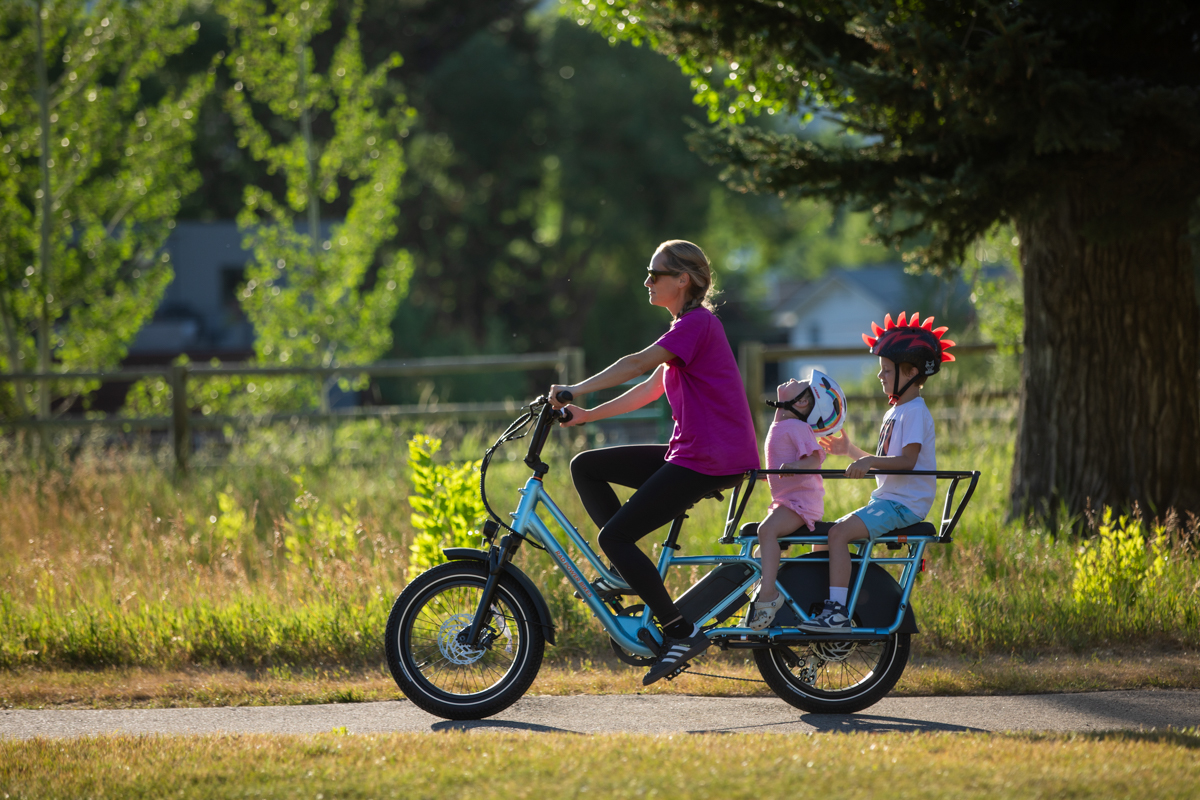 Women Riding E-Bike with Kids