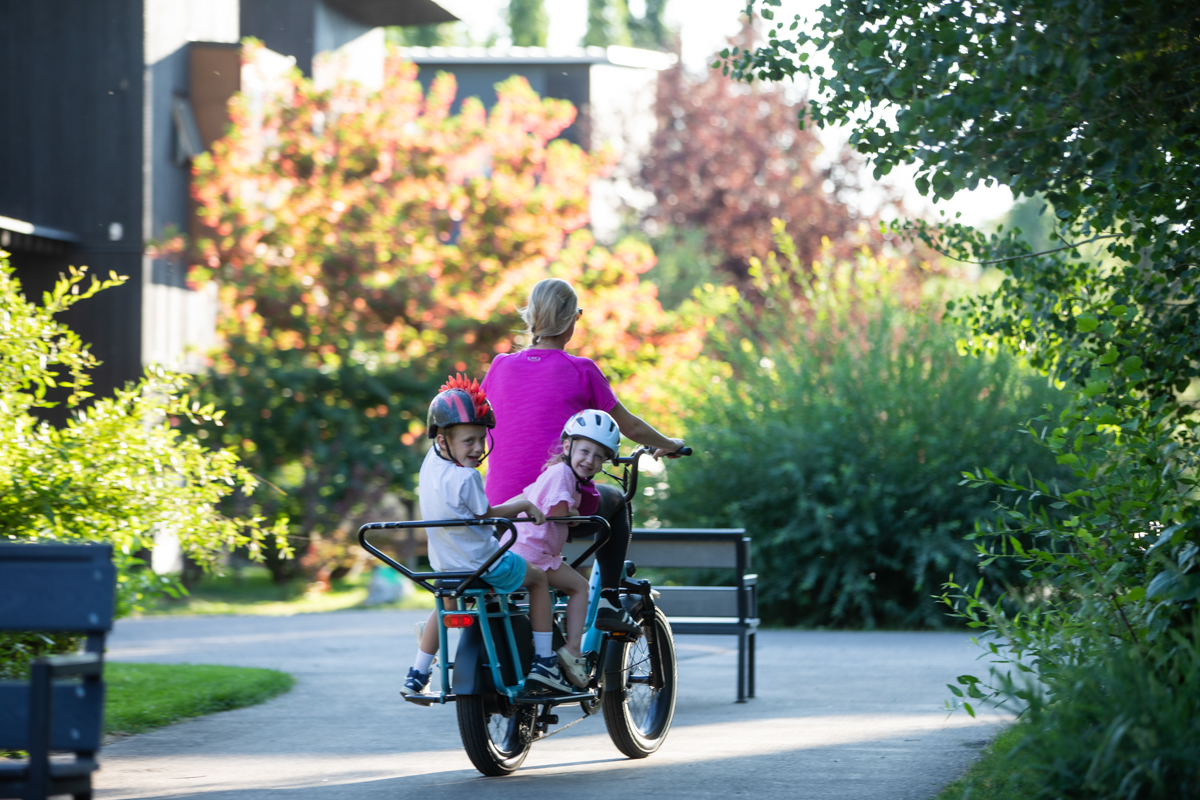 Happy Family Riding E-Bikes