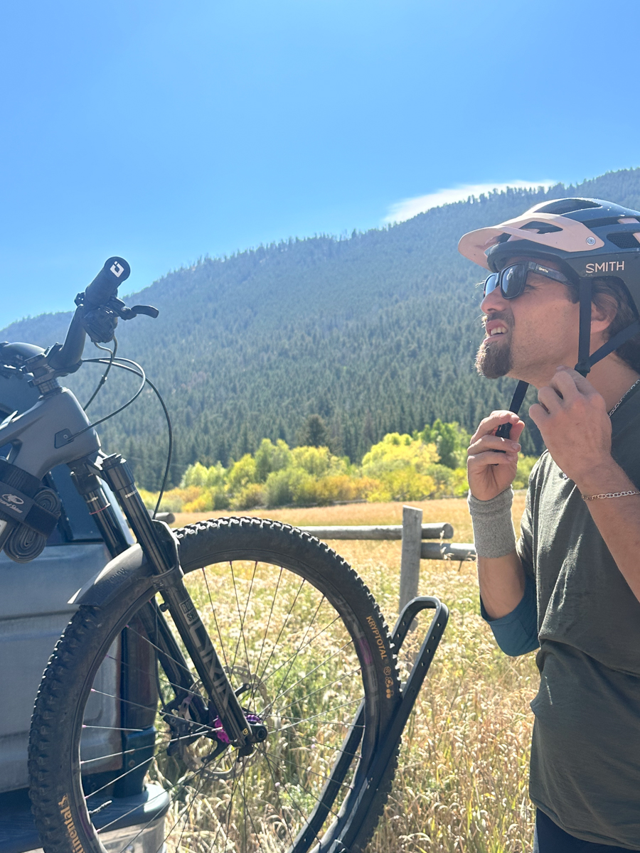 Man Putting on Smith Bike Helmet