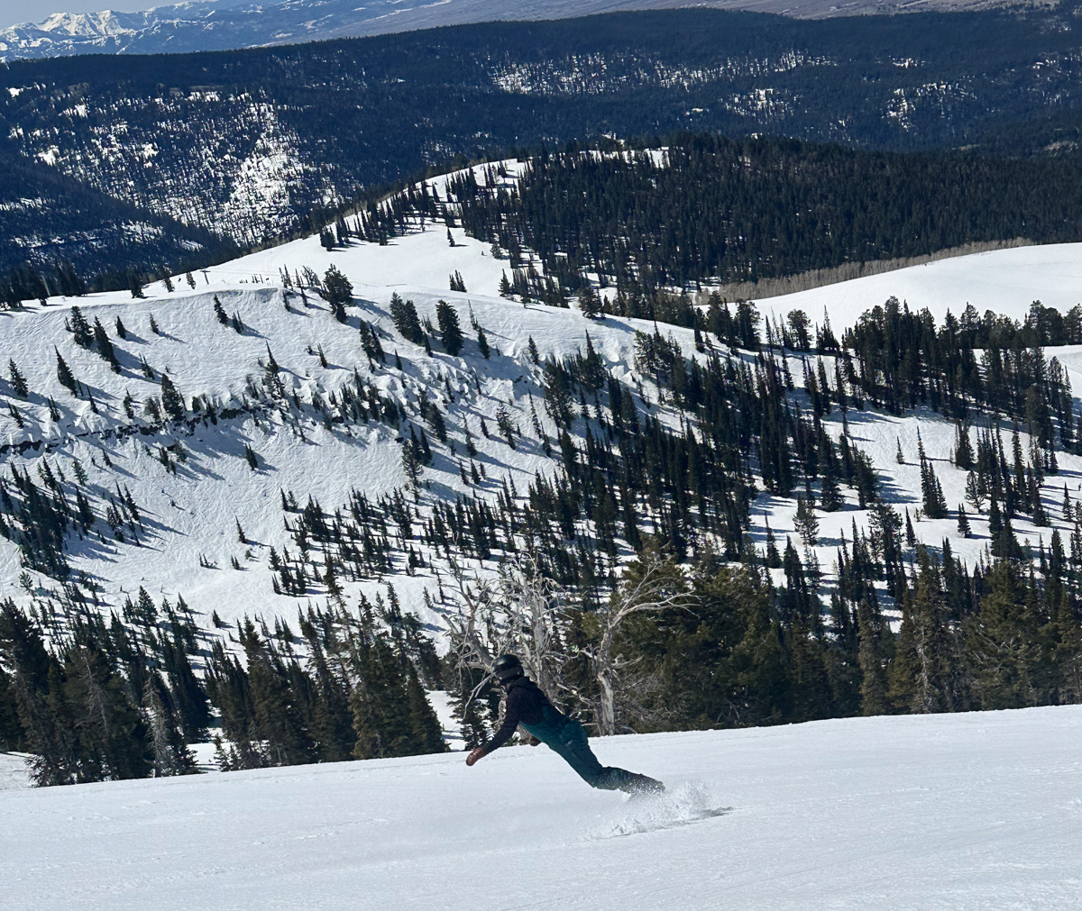 Women Riding Fast on a Snowboard