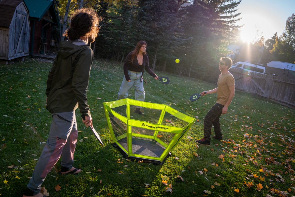 Group of People Playing Paddleball