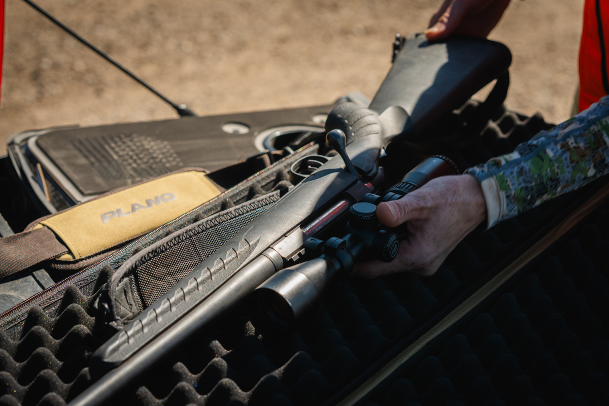 Man Putting Rifle in Case