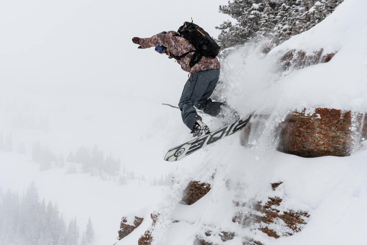 Getting Sendy, Snowboarder Jumping off Rocks
