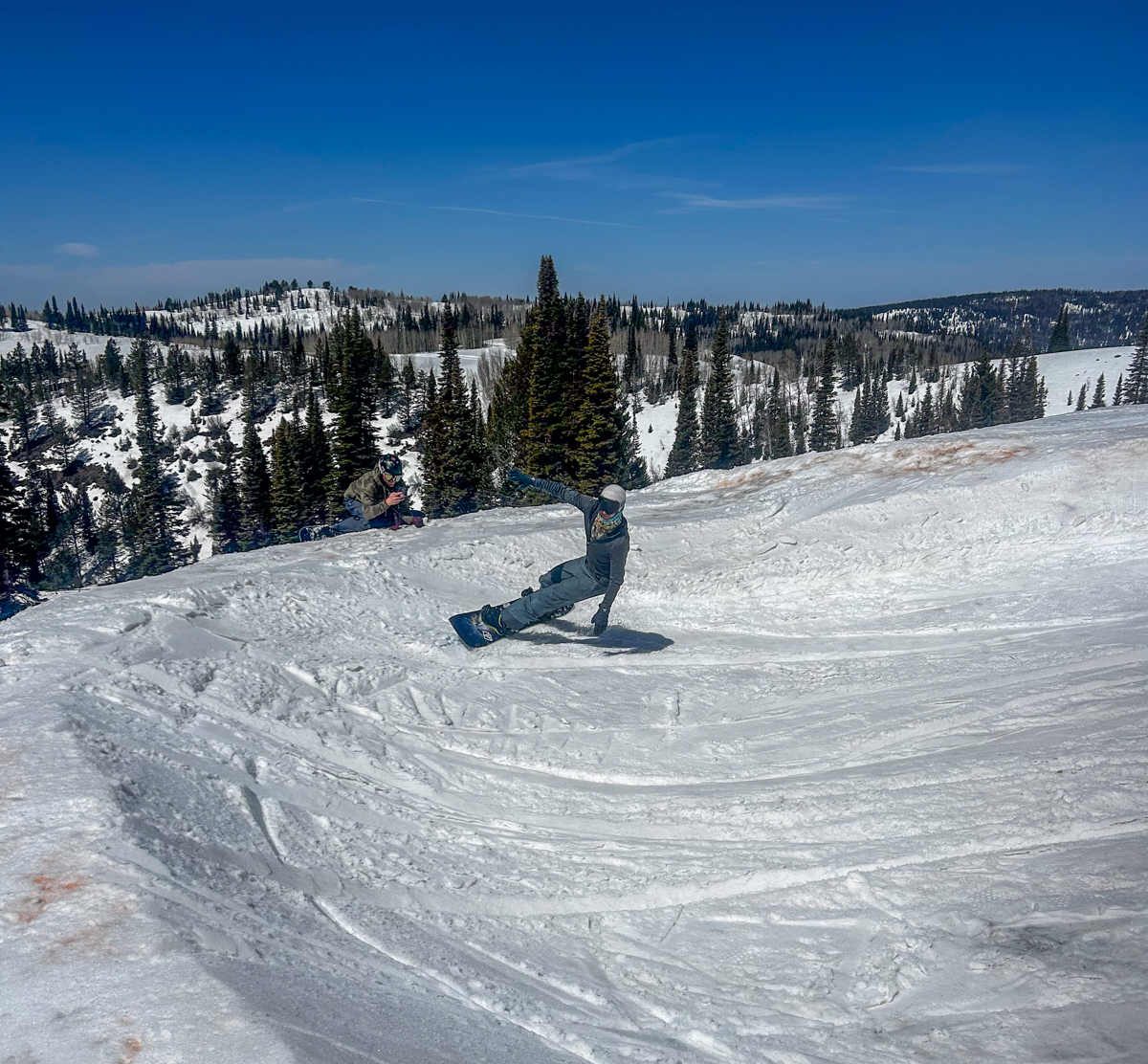 Man Riding Surf Bank on Snowboard