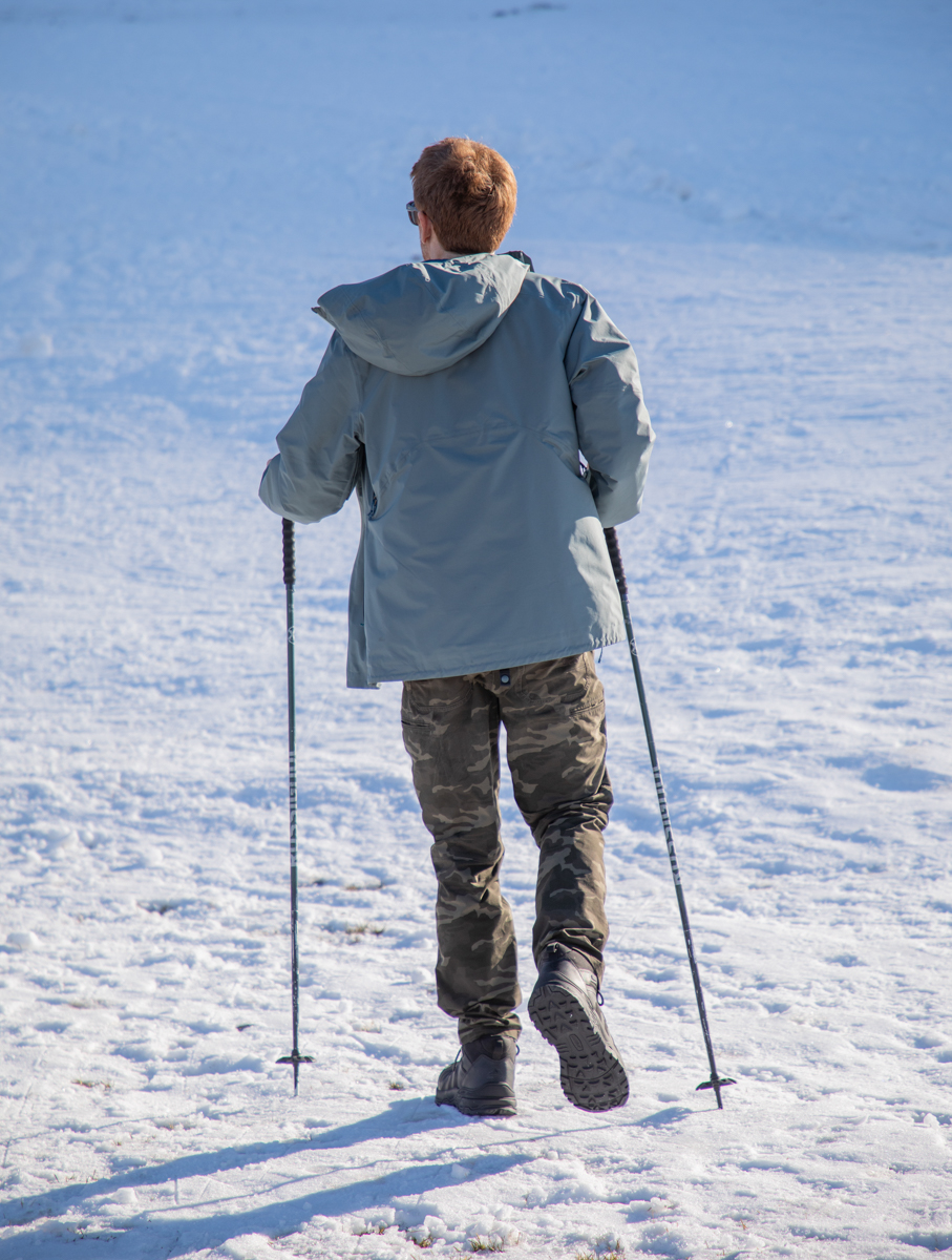 Man Hiking up Snowking Mountain