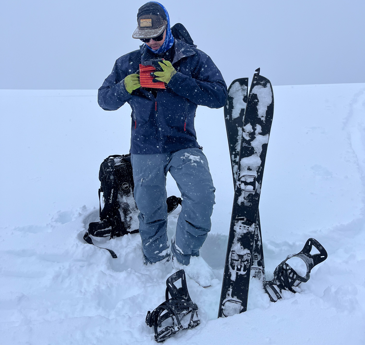 Man in the Mountains Transitioning into Splitboard