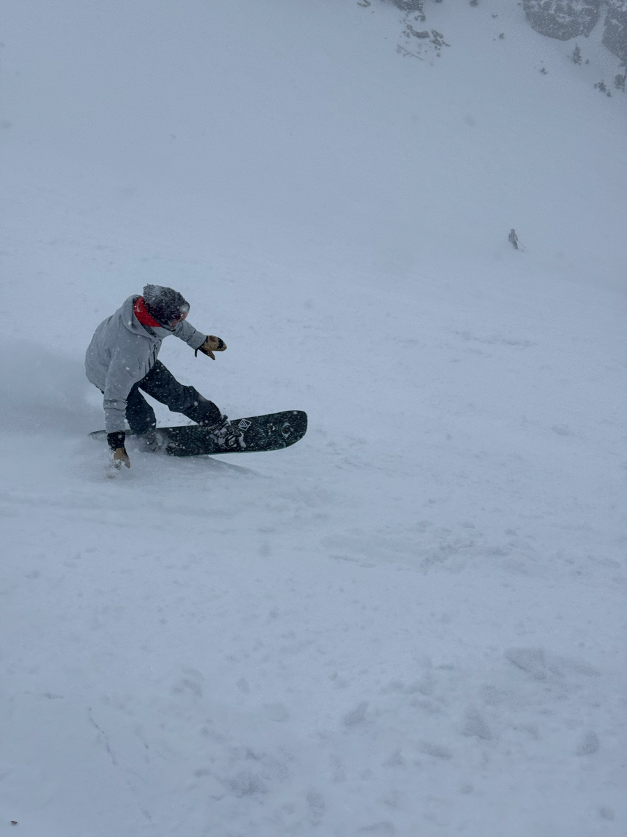 Man Snowboarding Powder