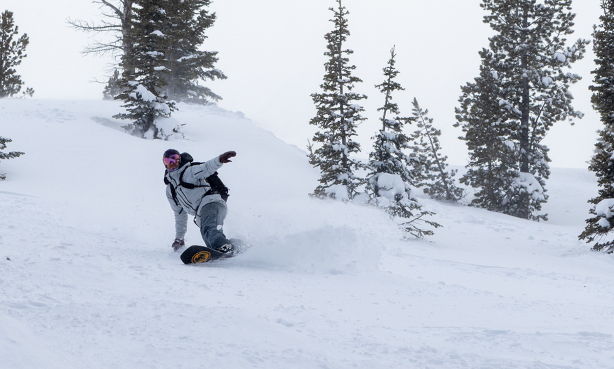Man Making Snowboard Turn