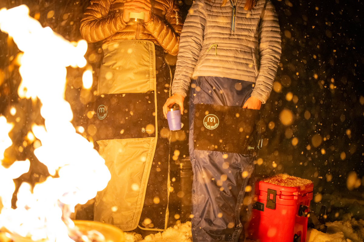 Women Standing Around Fire with Warmth from Mozy Blanket