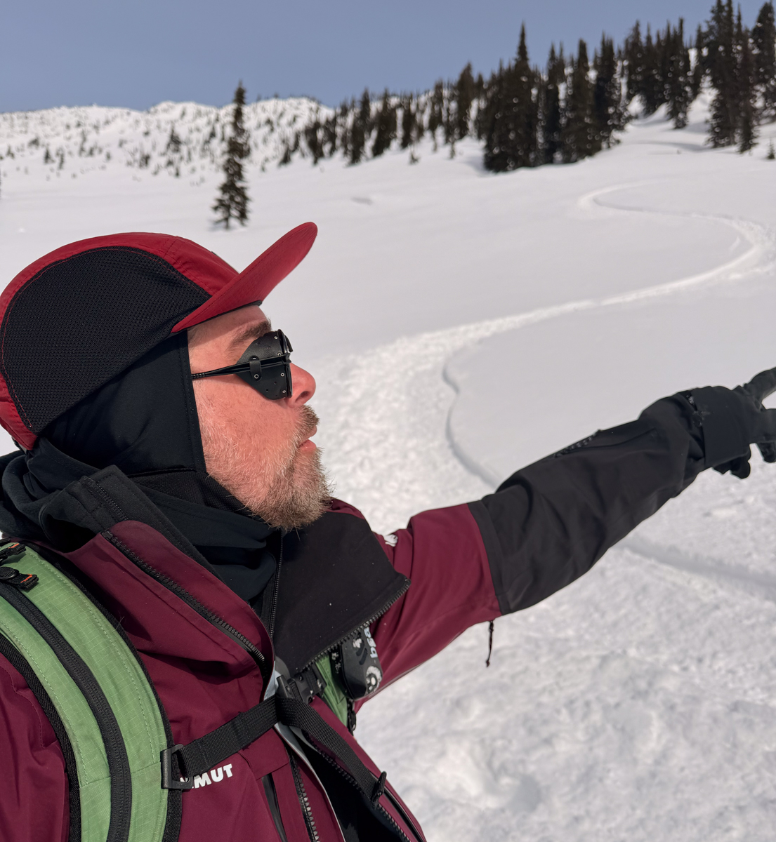 Man Splitboarding in Sunglasses
