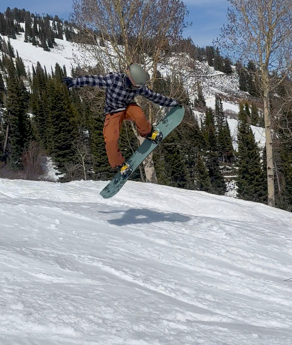 Advanced rider testing the pop and air-time of the 2027 K2 Commonwealth Snowboard in Jackson Hole.