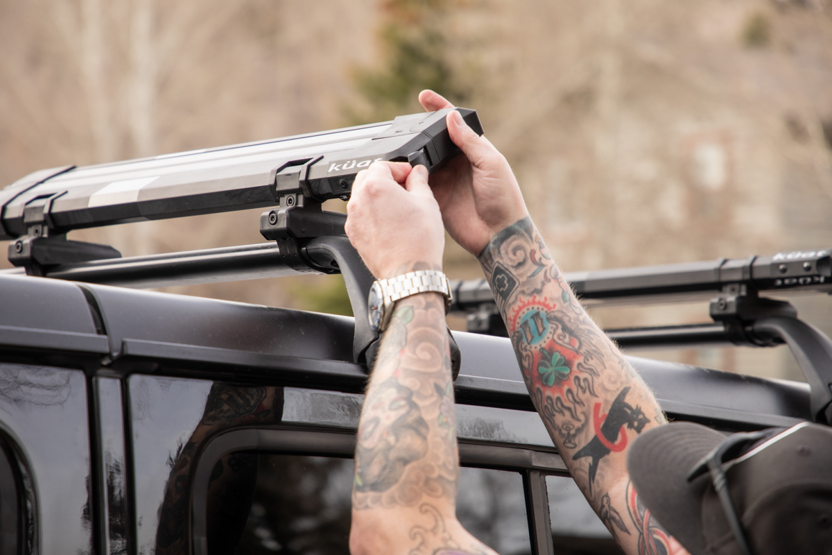 Man Adjusting Ski Rack