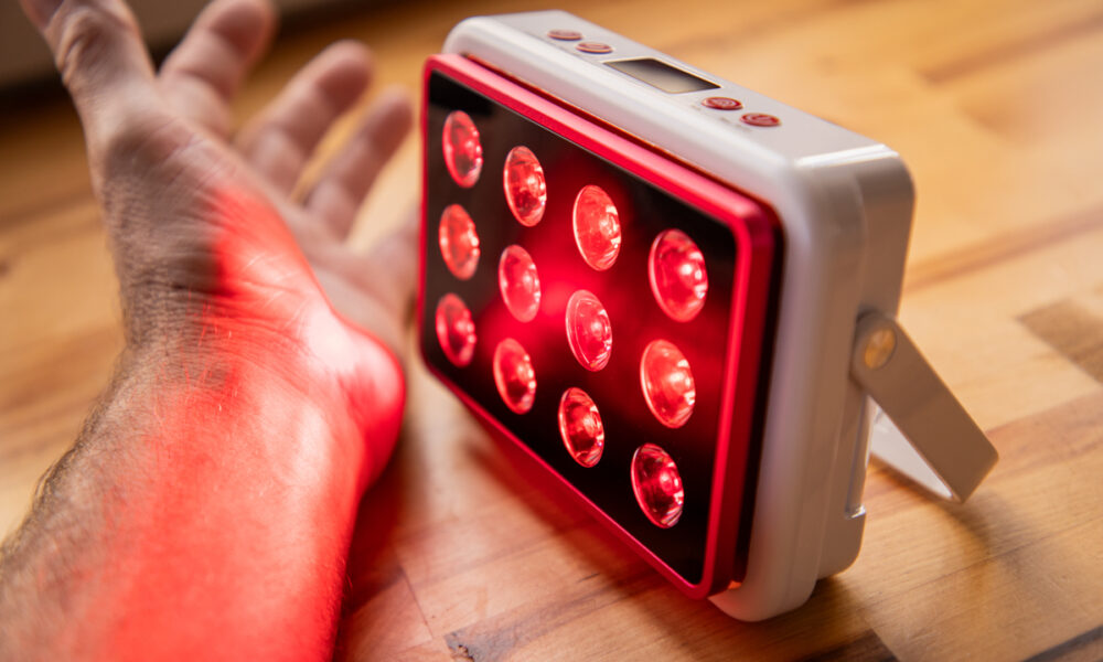 Handheld use of the MitoPRO Mobile on the forearm to treat muscle inflammation and tendonitis with clinical-grade light.
