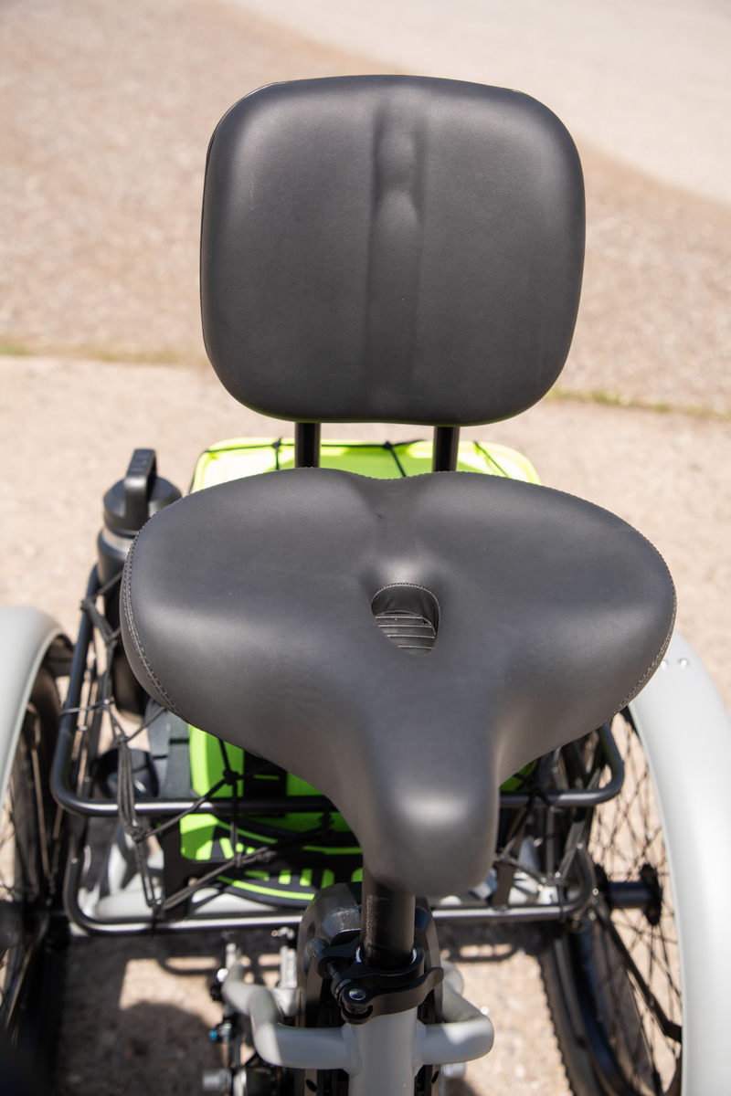 Close-up of the vacuum foam comfort seat and adjustable backrest on the Mooncool TK2 e-trike.