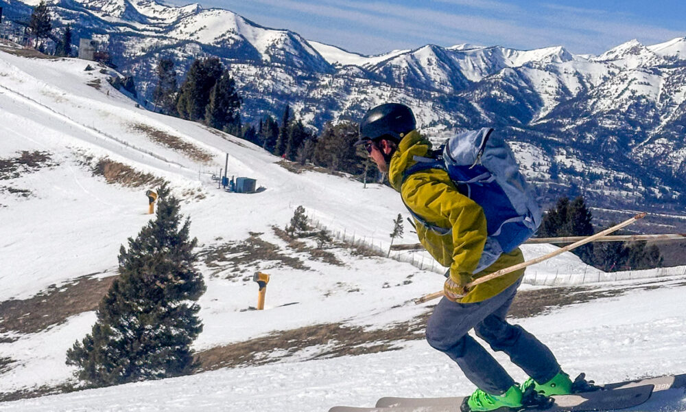 Man Skiing While Testing Patagonia PowSlayer Backpack