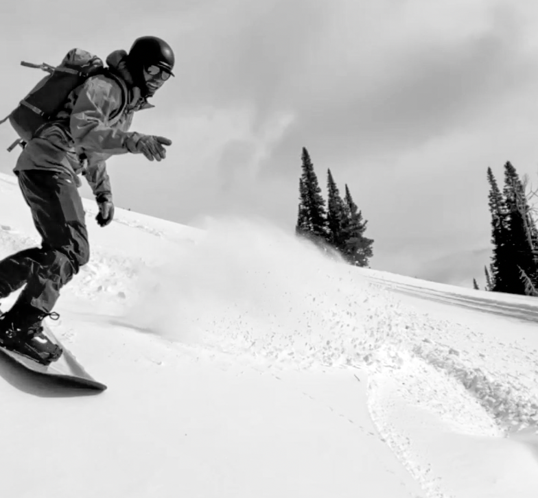 Man Riding Splitboard Downhill